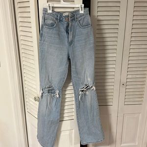 Stradivarius blue, ripped, straight jeans. USA 2; EUR 34.